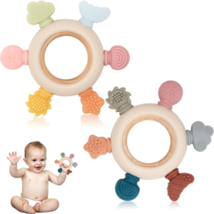 [baby holding teether