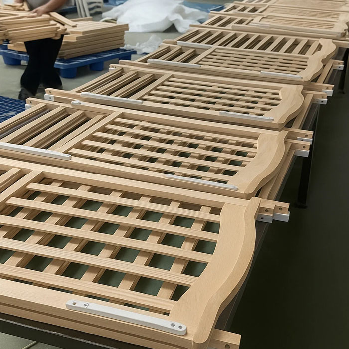A quality inspector measuring crib slat distance