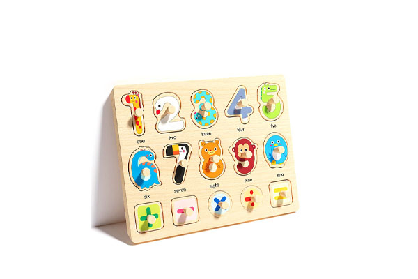 A close-up of a wooden Montessori toy with minimal, purposeful color
