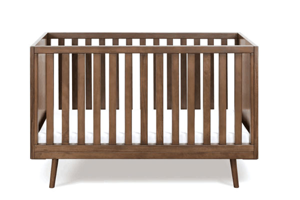A close-up of the wood grain on a Babyletto crib