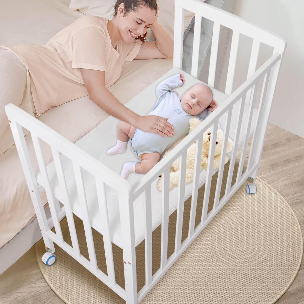 A close-up of the secure attachment straps on a sidecar crib