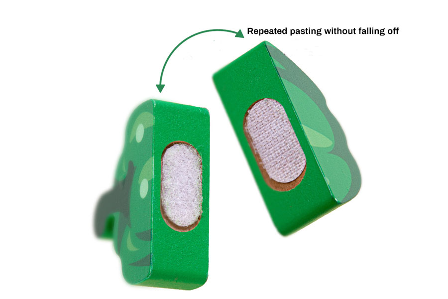 A close-up shot of a child's hands holding a smooth, solid wooden pear