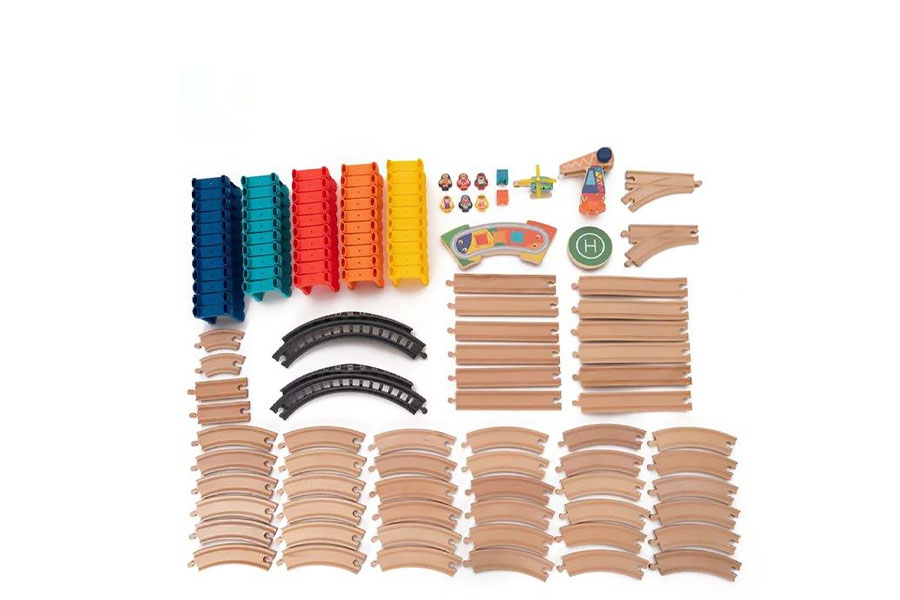 A solid, intact wooden track piece next to a cracked and broken plastic track piece.